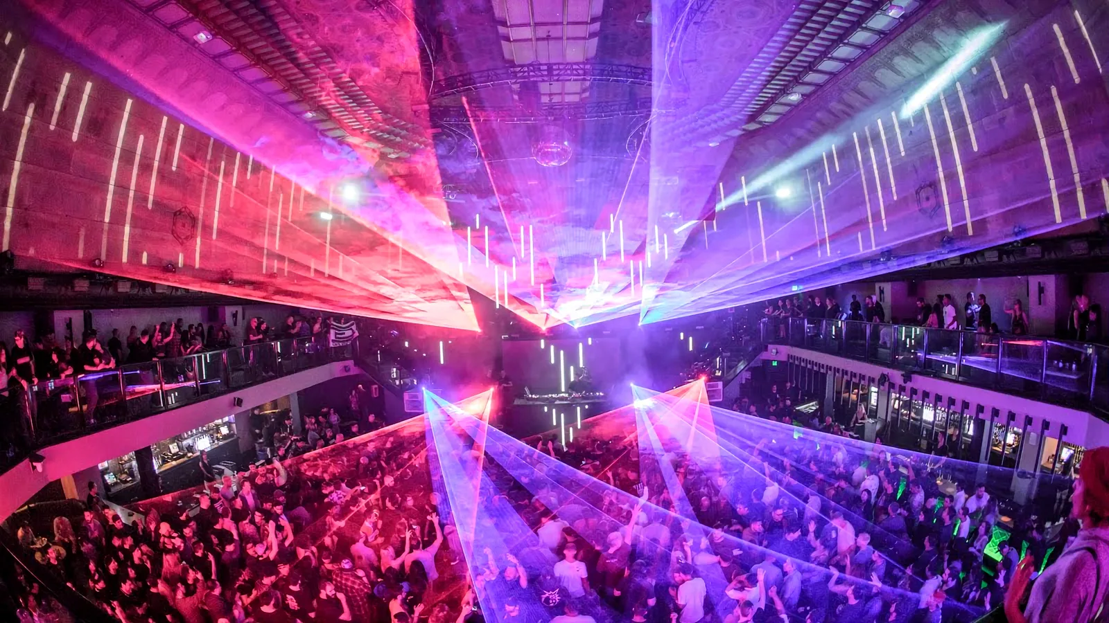A packed dance floor with a laser show at a Los Angeles nightclub.
