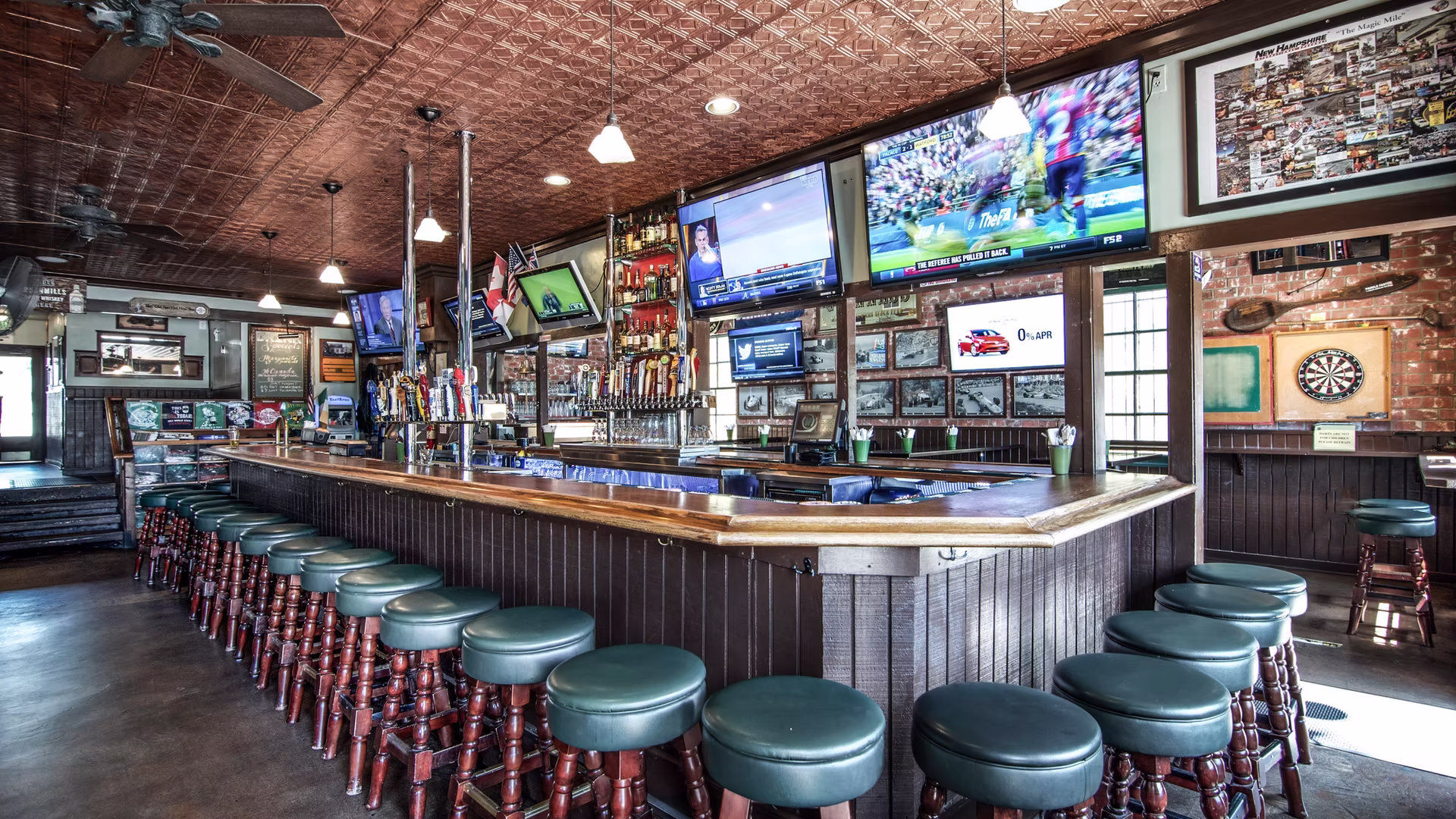 Irish sports bar interior with TVs and bar stools