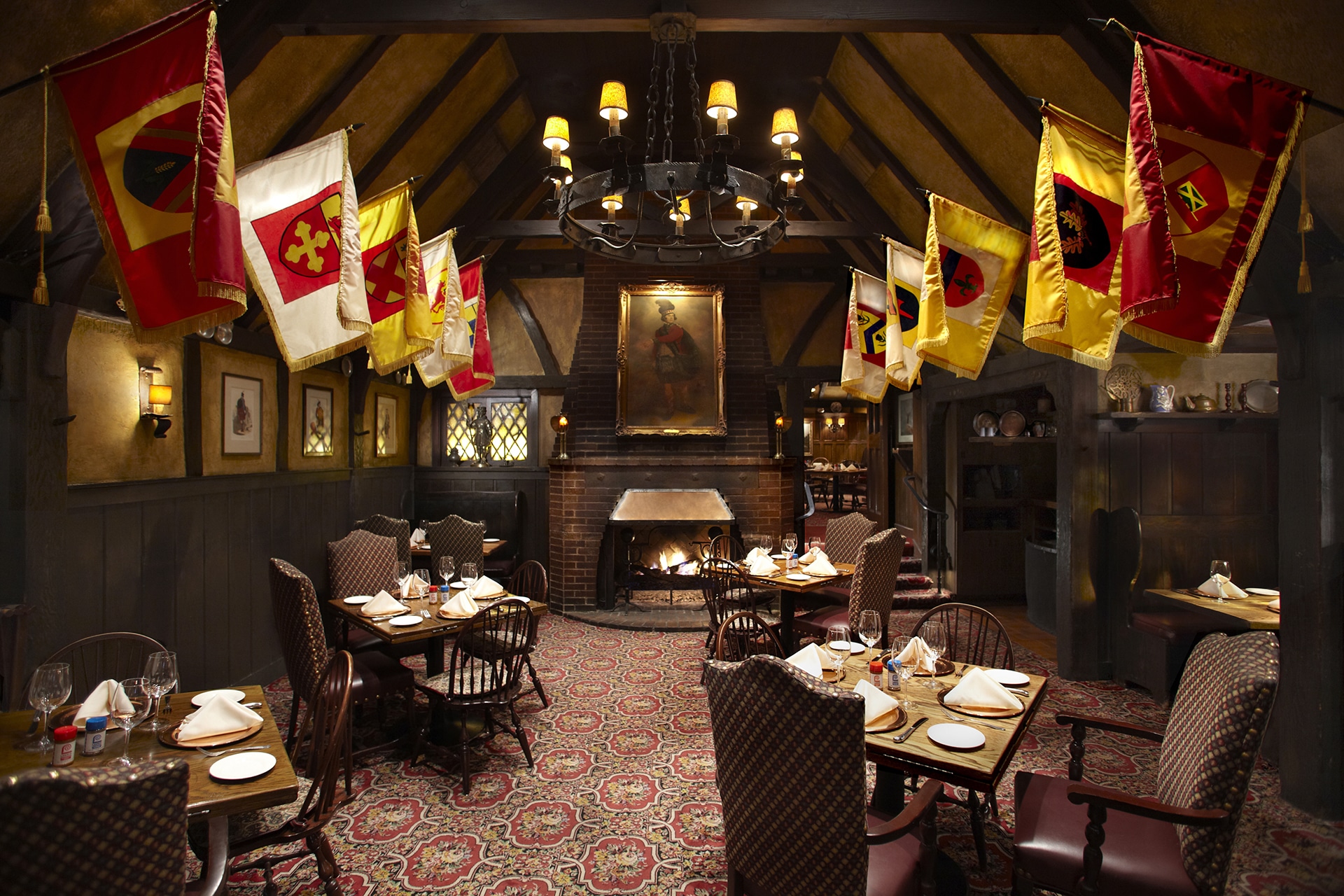 Irish pub restaurant interior with flags and fireplace