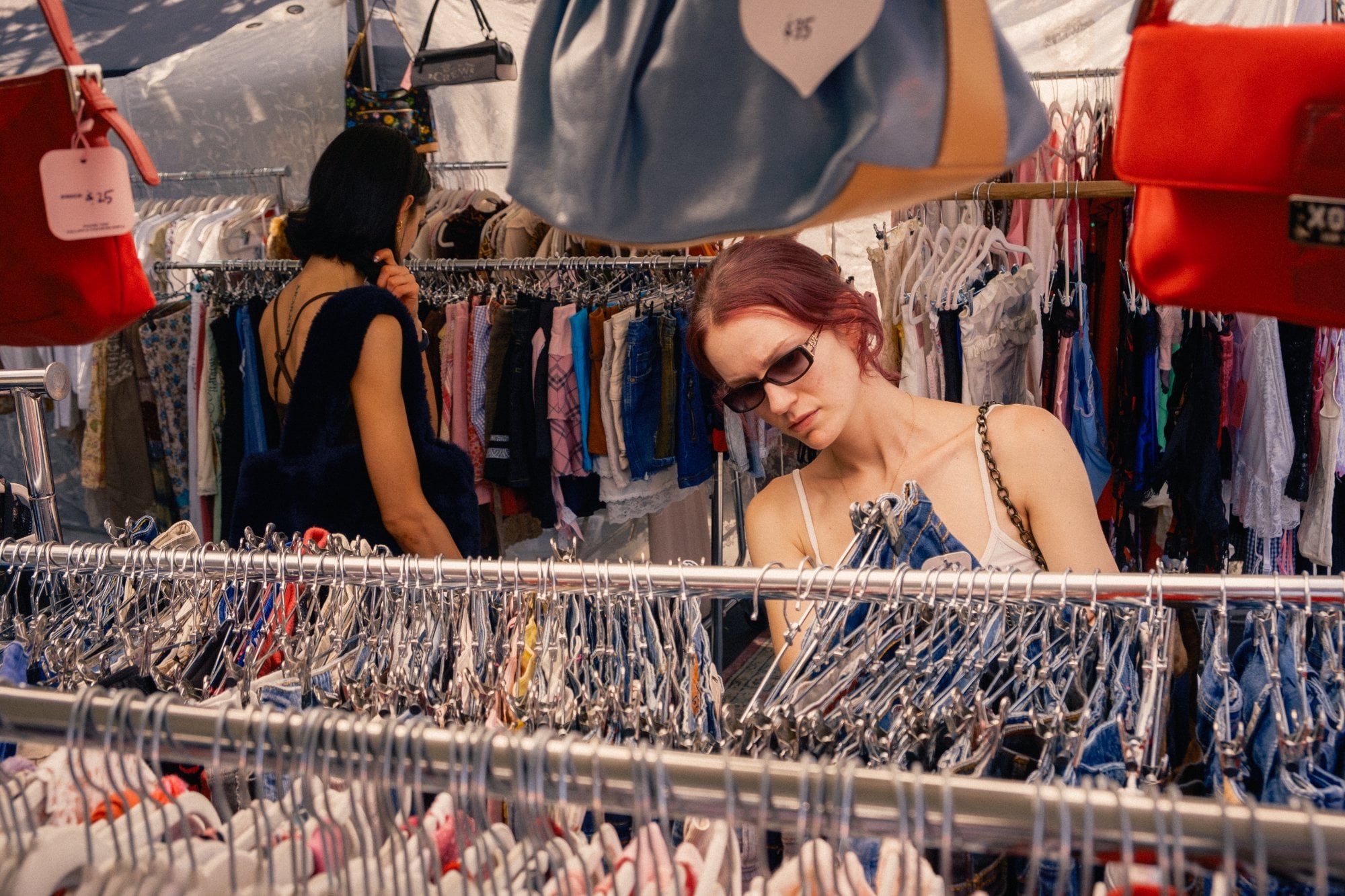 Browsing curated racks at a Los Angeles vintage shop