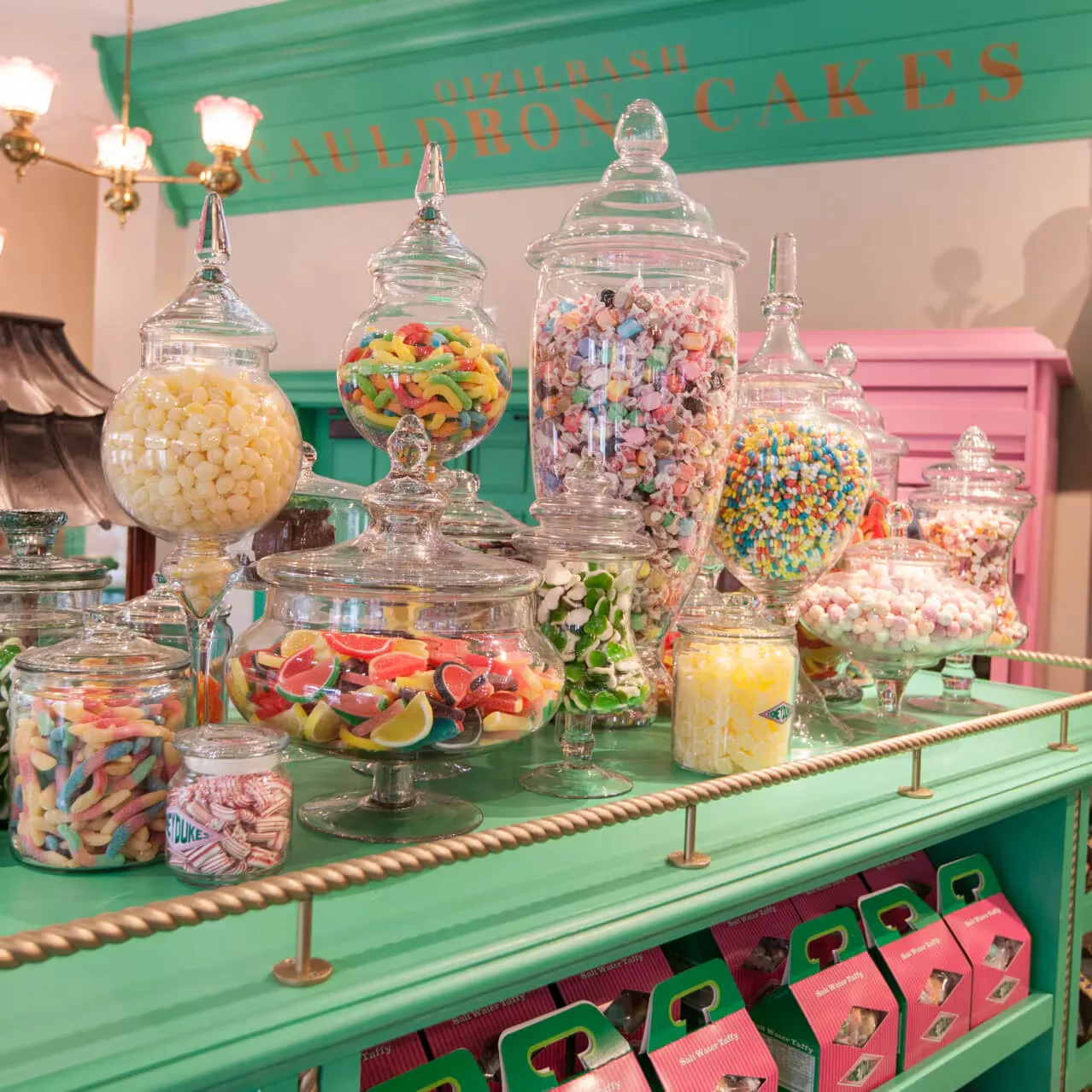 Sweet shop shelves crammed with jars, boxes and wrapped candy