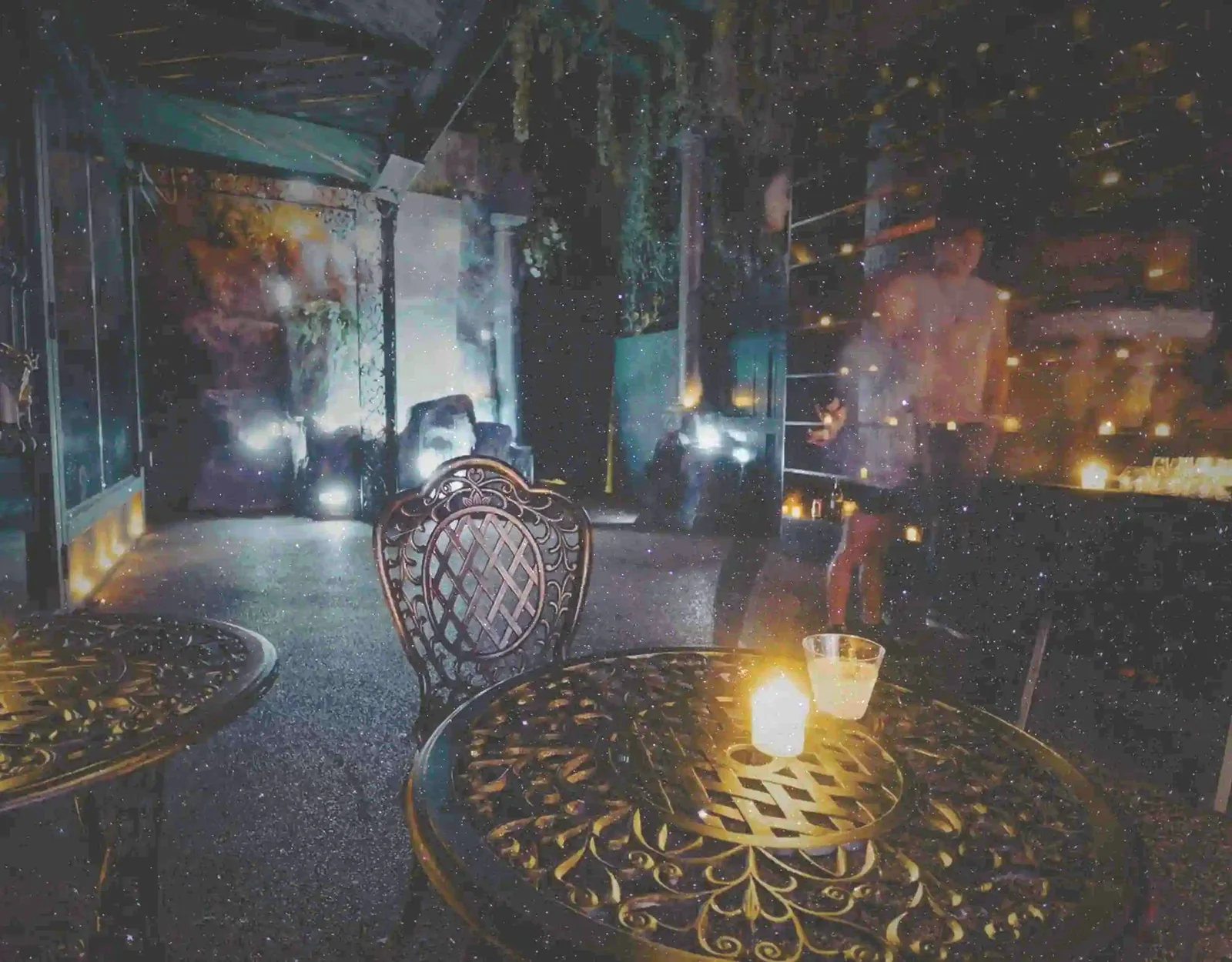 Candlelit interior of The Obscure immersive distillery and cocktail experience