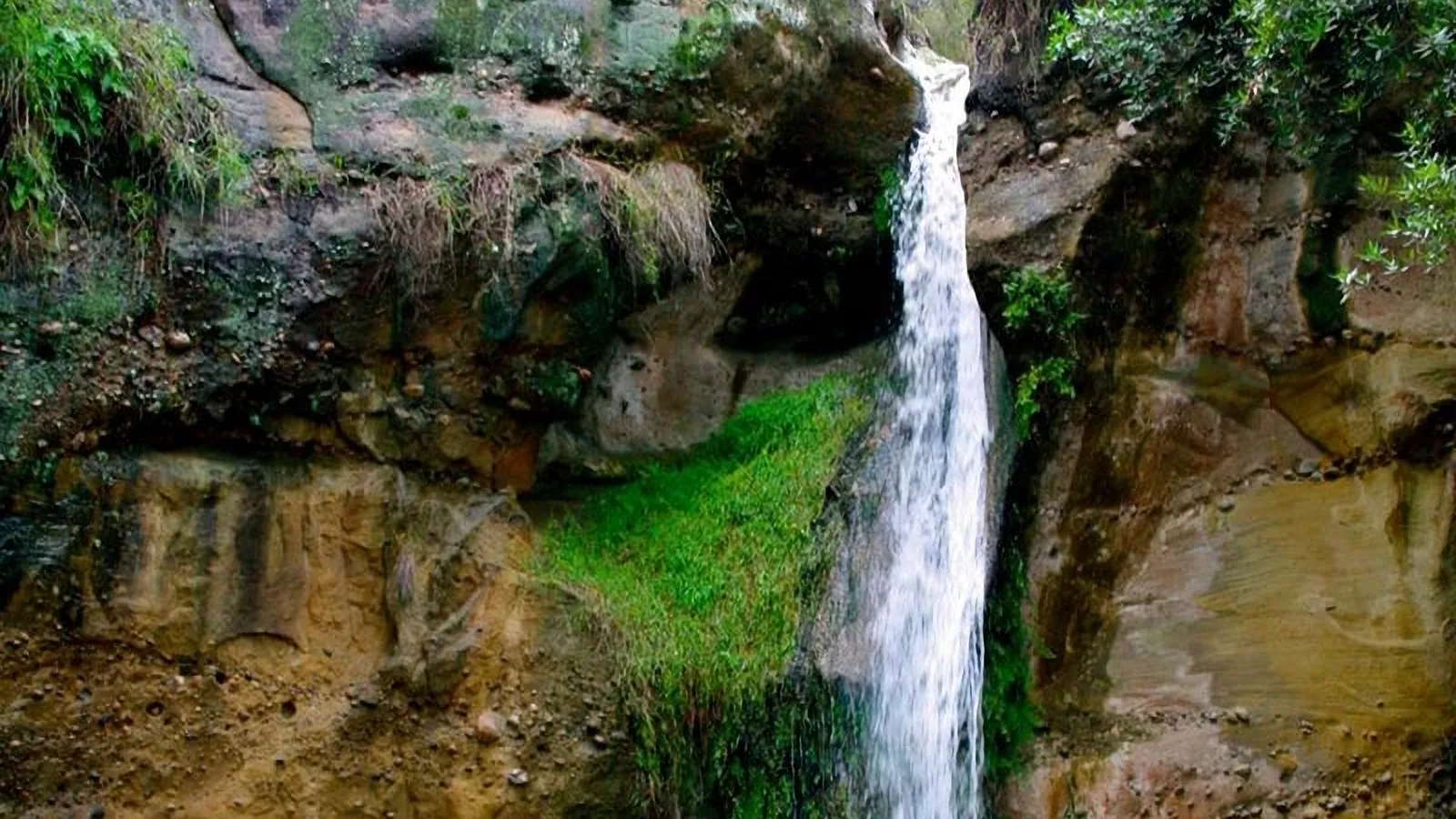 A small natural waterfall located in the Topanga Canyon area of Southern California (525 S Topanga Canyon Blvd, Topanga, CA 90290), known as a scenic spring‑fed cascade near the Jalan Jalan Imports shop.