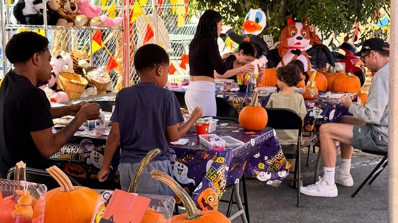 Children decorating pumpkins at Pasadena Pumpkin Patch.