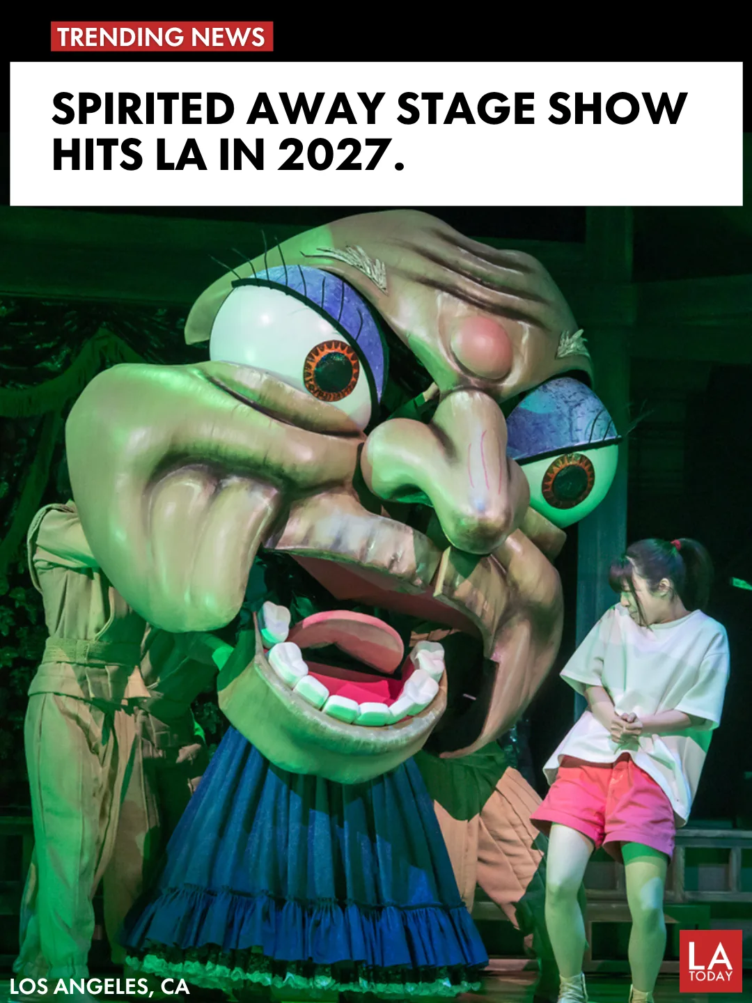 A large puppet creature from the Spirited Away stage adaptation performing alongside an actor