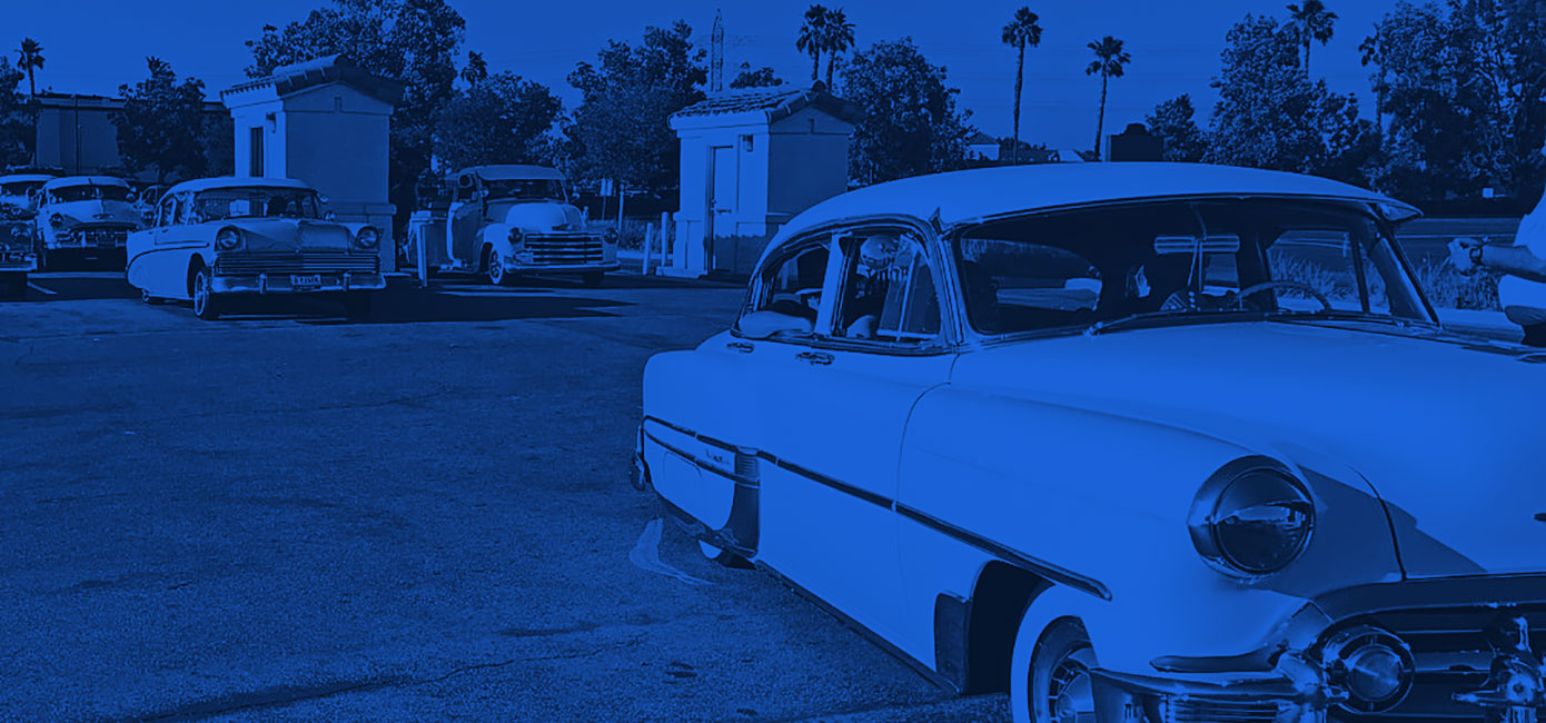 Cars before the screens at the Paramount Drive-In Theatres