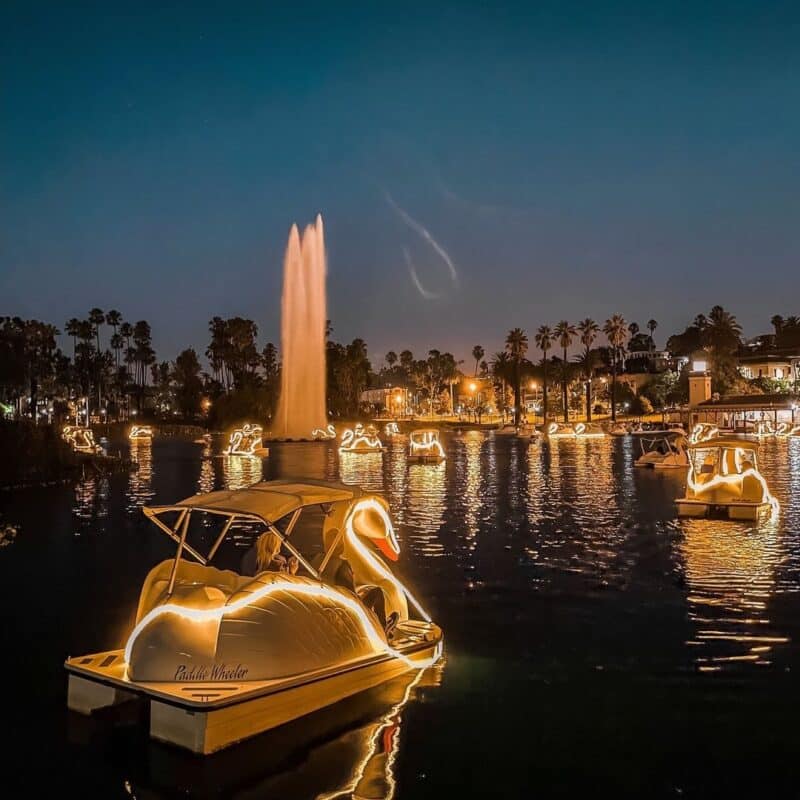 Swan pedal boats on Echo Park Lake with the fountain and skyline