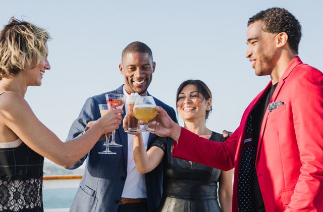 Guests toasting on a City Cruises holiday dinner yacht in Long Beach