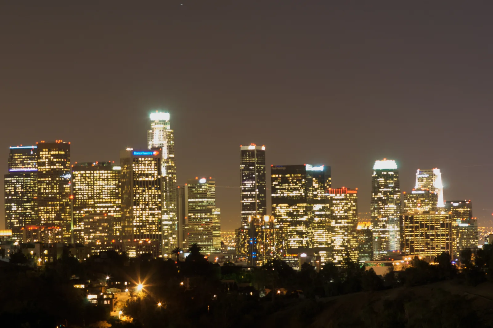 Downtown Los Angeles skyline glowing at night on New Year's Eve