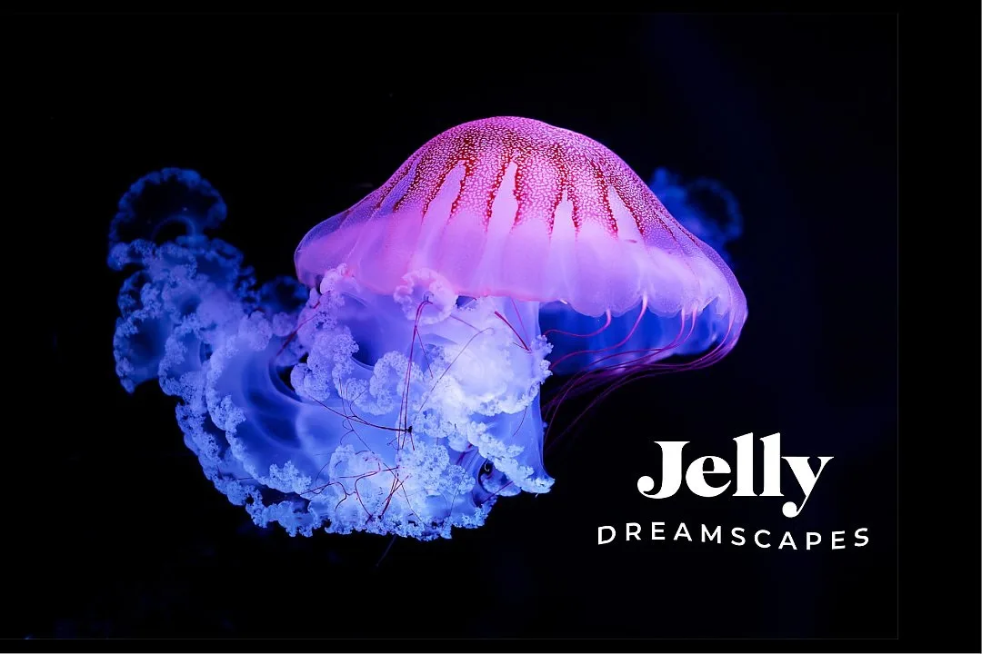 Glowing jellyfish against black with exhibit lettering overlaid