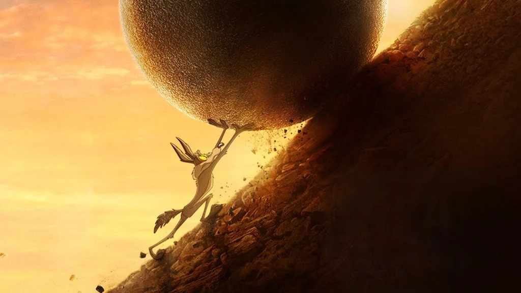 Key art for Coyote vs. ACME: Wile E. Coyote holding a giant boulder above him on a desert slope at sunset